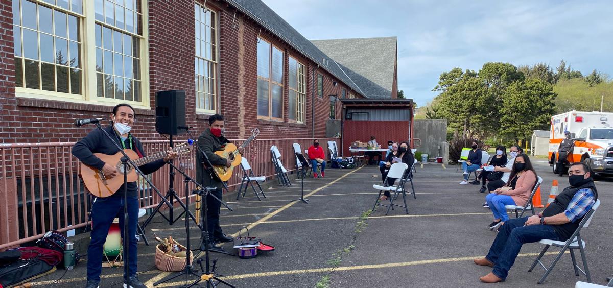 A band plays at a vaccine clinic in Lincoln City that was hosted by the Olalla Center for Latinx and Indigenous community members. OSU students and Extension employees were on hand to support the clinic.