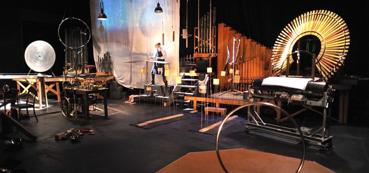 Wide shot of Schick Machine onstage with instruments