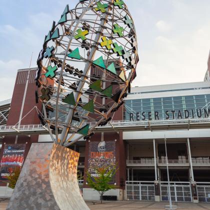 Football sculpture in front of  stadium