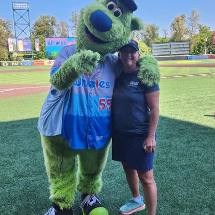 Image of Eugene Emeralds mascot and Leigh Torres of the Marine Mammal Institute.