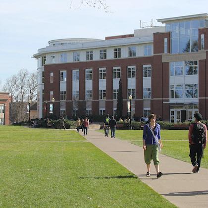 Stock image of students walking near the library on OSU campus