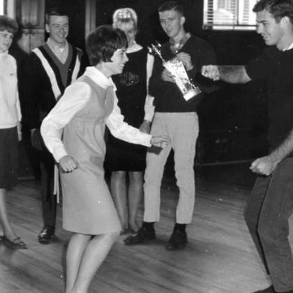 dance contestants Marsha Fowler '68 and Jim Martin '66. Standing in back are Dianne Conn, Mike Aldrich, Gail Boersma and Dick Alexander.