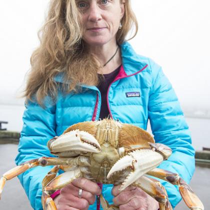 OSU's Kathleen O'Malley with a Dungeness crab.
