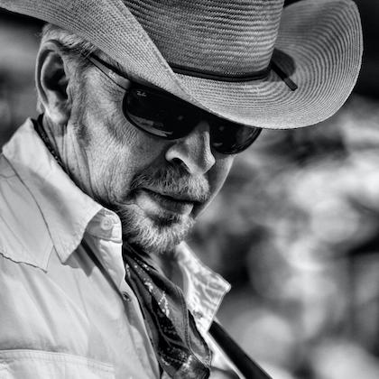 Black & white publicity photo of Dave Alvin