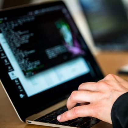 Hands at computer keyboard