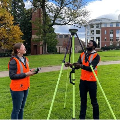 Ellery Ohlwiler and David Abiola collect Global Navigation Satellite System (GNSS) data on the OSU campus. Photo by Chris Parrish, OSU College of Enginering.