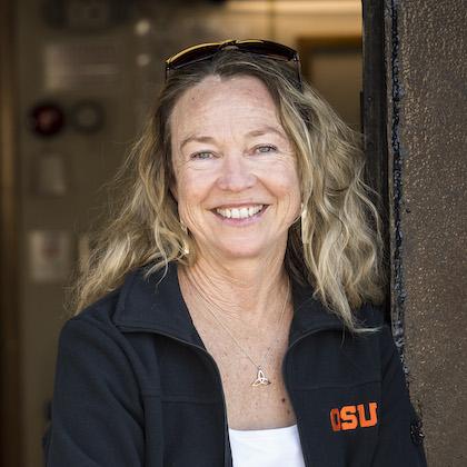 Headshot of Lisa Ballance, one of this year's fellows, wearing a black OSU-emblem jacket over a white shirt.