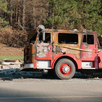 Image of the burned-out front half of a fire truck in Detroit, Oregon in 2020.
